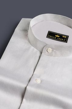 Step into understated sophistication with our Iron Gray Chambray Mandarin Collar Shirt. The muted elegance of iron gray meets the casual charm of chambray fabric, creating a versatile and stylish piece. The mandarin collar adds a touch of refinement, making this shirt suitable for both casual and semi-formal occasions. Fused collar and cuffs, collar stand and flat felled side seams provide structure and stability to all our shirts. 100 % Premium Giza Cotton: Long staple, smother, resistant to pi Classic Gray Formal Tops, Classic Summer Shirt With Stand Collar, Classic Stand Collar Top With Button Closure, Classic Tops With Stand Collar And Button Closure, Classic Top With Stand Collar And Button Closure, Classic Cotton Top With Stand Collar, Elegant Gray Top With Button Closure, Formal Cotton Top With Stand Collar, Elegant Gray Collared Shirt