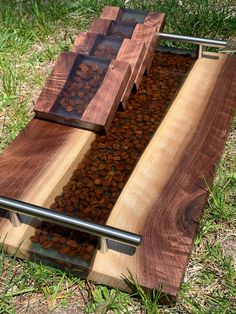 a bench made out of wood and metal with lots of coffee beans in the middle