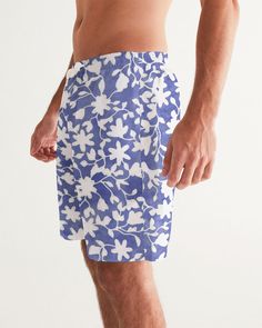 About The Art Camo Flower Sky Using flowers to create anew and stylish camouflage look. Product Details Head to the beach in our classic fit Men's Swim Trunks made with comfort in mind. With an adjustable drawstring waistband, its smooth and durable materials made with UPF 50+ gives you premium UV protection. Soft, lightweight fabric Drawstring waistband UPF 50+ Built-in mesh brief Two side, one back slip pocket Printed, cut, and handmade Size & Fit Runs true to size Inseam 7" Measurements vary, White Swim Trunks For Spring Beach, White Swim Trunks For Spring Beach Outing, Casual Floral Print Swim Trunks For Vacation, Casual Floral Print Swim Trunks For Beach Season, Casual Swim Trunks With Floral Print For Beach, Spring Beachwear Swim Trunks With Floral Print, Spring Floral Print Swim Trunks For Beach, Casual Floral Print Spring Swim Trunks, White Relaxed Fit Swim Trunks For Beachwear