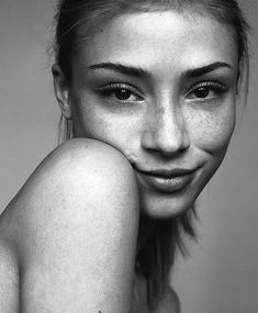 a black and white photo of a woman's face