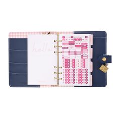 a pink and blue planner with a pad attached to it