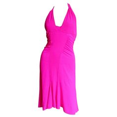 A fabulous bight pink silk dress from Versace. It has a halter neckline, ruched side waist and the skirt flares at the hem and is slightly longer in the back. The back waist has incredible detail with 4 silver metal adjustable, functional buckles and matching fabric straps. It is lined in the same fabric and has a matching side invisible zipper. Fits sizes Extra Small, Small, Medium. Marked Italian size 42. Bust Open Waist 27-30" Hips 37-40" Length 37-46" Elegant Pink Backless Halter Dress, Pink Backless Halter Dress For Formal Events, Pink Fitted Halter Dress For Evening, Pink Ruched Halter Dress For Party, Pink Halter Neck Evening Dress, Pink Halter Neck Dress With Fitted Bodice, Pink Ruched Backless Dress, Pink Backless Halter Dress For Evening, Elegant Pink Halter Dress For Cocktail