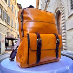 "This Italian leather Backpack is a true masterpiece of craftsmanship. Handmade in Florence, Italy, it combines luxurious materials and exquisite attention to detail. Elevate your style and travel in sophistication with this elegant backpack. . Size: Height: 39 cm (15.35 inches) Depth: 31 cm (12.20 inches) Width: 13 cm (5.12 inches) Color: Yellow . The story of this backpack: In the heart of Florence, where the legacy of artisanal craftsmanship dances through the air like a melody, a workshop hums with the creation of a masterpiece--an Italian handmade leather backpack. This story unfolds within the walls where skilled hands weave dreams into reality, bringing forth a men's backpack that embodies the essence of tradition, quality, and timeless elegance. Selected with meticulous care, the l Luxury Brown Backpack For Daily Use, Luxury Brown Rectangular Leather Backpack, Luxury Brown Backpack With Leather Backing, Luxury Leather-backed Backpack For Daily Use, Luxury Backpack With Leather Backing For Daily Use, Brown Luxury Backpack, Luxury Brown Rectangular Backpack, Luxury Backpack With Leather Backing, Luxury Leather Rectangular Backpack