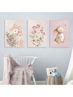 three paintings are hanging on the wall in a child's room with a crib