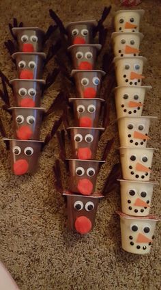 these cups are decorated to look like the faces of snowmen and reindeers with googly eyes