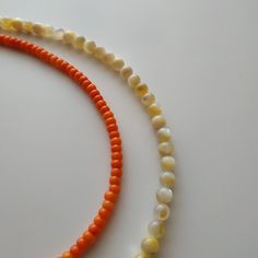 < Coral necklace with nacre beads > The pearls are natural nacre beads. Like 99% of the coral on the market these days, this coral has been dyed. I use bamboo coral which is not endangered or threatened in any way, unlike natural pink or red coral (the production of which is forbidden almost everywhere in the world). Bamboo coral doesn't mean it's not organic. Every bead of it has a distinctive and beautiful coral pattern. My jewelry dyed with high quality paint. It's safe for your health Coral Beaded Pearl Necklace As Gift, Gift Coral Beaded Pearl Necklace, Orange Polished Bead Necklace As Gift, Orange Beaded Necklace With Polished Beads As Gift, Pearl White Shell Necklace With Round Beads As Gift, Beaded Shell Necklace With Mother Of Pearl Round Beads, Beaded Shell Necklace With Round Mother Of Pearl Beads, Beaded Mother Of Pearl Shell Necklace With Round Beads, Mother Of Pearl Beaded Necklaces With Polished Round Beads