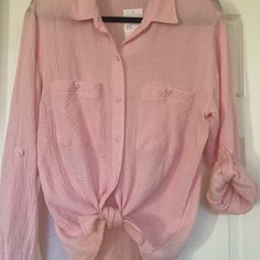 This Nwt Beautiful Blouse By Sanctuary Is A Size Small. It Has A Slight Pattern And Has An Almost Gauze Feel. It Is Lightweight And Perfect For Summer. Can Be Tied Or Worn Down And Sleeves Can Be Rolled And Buttoned. Purchased At Nordstrom. Pink Buttoned Beach Blouse, Pink Blouse With Buttons For The Beach, Feminine Buttoned Tops For Beach, Feminine Buttoned Tops For The Beach, Pink Button-up Shirt For Day Out, Chic Peach Cotton Top, Casual Peach Blouse For Spring, Peach Feminine Blouse For Day Out, Feminine Peach Blouse For Day Out