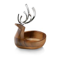 a wooden bowl with metal antlers in it