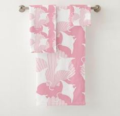 pink and white towel hanging on the wall