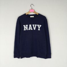 Vintage Rare NAVY Crewneck Sweatshirt Big Logo Spell Out NAVY Jumper Pullover NAVY Sweater Navy Blue Colour Unisex Medium Size CONDITION :- ✅GOODUSED CONDITION. ✅NO STAINS  ✅NO HOLE ITEM DESCRIPTION:- ✅SIZE: M ✅MATERIAL : COTTON ✅THIS USED & VINTAGE ITEMS, SO DON'T EXPECTED IT TO BE LIKE NEW CONDITION!! MEASUREMENT: ✅ARMPIT TO ARMPIT : 19 INCH ✅LENGHT NECK TO : 25 INCH ✅SHOULDER :  16.5 INCH  ✅SLEEVE: 22 INCH PLEASE REFER PHOTO BEFORE ORDER √ALL MEASUREMENTS ARE TAKEN WITH THE GARMENT FLAT ON TH Cheap Navy Crew-neck Top, Cheap Navy Sweatshirt For Streetwear, Navy Blue Colour, Navy Jumper, Navy Crewneck, Sweater Navy Blue, Navy Sweater, Navy Blue Color, Navy Sweaters