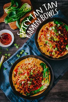 two bowls filled with noodles and vegetables on top of a table