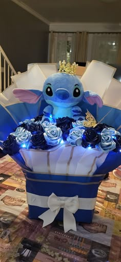 a blue and white basket filled with flowers