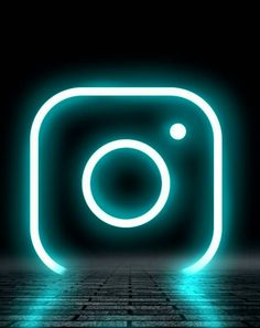 an instagram logo in the dark with blue light coming from it's center