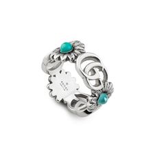 Style ‎527394 J8474 8517An archival reprisal of the House's signature emblem, the Double G motifs appear on a 925 sterling silver ring, separated by flowers with colored stones at the center.925 Sterling silver with aged finishDouble GFlowers with mother of pearl, turquoise-colored resin and blue topaz stonesBand width: .75"Size: 6.75Made in Italy Gucci Marmont, Gucci Jewelry, Turquoise Ring Silver, Gucci Gg Marmont, Blue Topaz Stone, Luxury Rings, Gg Marmont, Topaz Stone, Multi Stone Ring