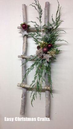 an image of a wooden wall decoration with branches and berries on it, hanging on the wall