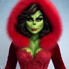 a woman with green skin and red fur on her head is dressed as the grin