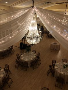 an overhead view of a banquet hall with chandelier and tables set for dinner