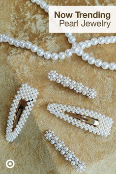 pearl jewelry is displayed on a carpet with the words now trending pearl jewelry written below it