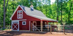 a red barn with a horse in it