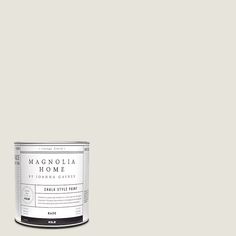 a white paint can with the words magnolia home painted on it's bottom half