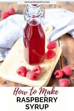 raspberry syrup in a glass bottle with fresh raspberries on the side