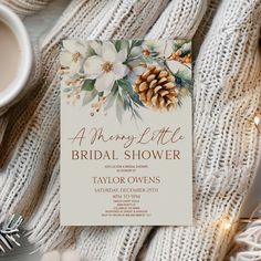 an elegant winter bridal shower with pine cones and flowers