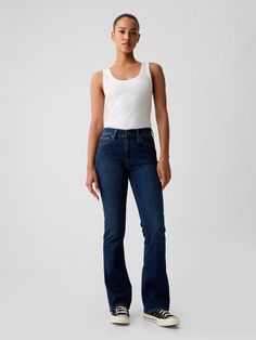 Fit: A full-length slim fit with a mini bootcut leg. ​ Fabric: 81% Cotton, 4% Recycled Materials, 6% Stretch.  Stretch: High Stretch Jeans.  Innovative stretch with high recovery.  Made to move & always bounces back. ​ Rise: Mid Rise Jeans.  Look: A classic five-pocket jean in a dark wash.  Details: Zip fly & five-pocket styling.  Responsibly Made: This pair of jeans is part of our water-saving Washwell program.  Compared to conventional wash methods, Washwell has saved millions of liters of wat Jeans Look, Boot Jeans, Baby Boots, Pocket Jeans, Mid Rise Jeans, Petite Size, Stretch Jeans, Jeans And Boots, Mid Rise