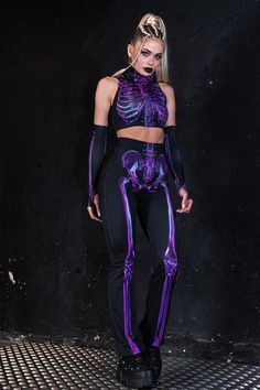 "Purple skeleton leggings cuz you're cold down to the bone. These funky bell bottom pants have printed bones on the front and the back and stretchy construction. > The outfit glows in the dark if a strong U.V. light is near it. ► Material & Washing The leggings are made of high-quality four-way stretch Italian Lycra® that consists of 80% Polyester and 20% Elastane. But, boy, doesn't it feel smooth! Nothing beats wearing something so sleek and polished. > Give it a try, and you won't want to take Fitted Bottoms For Halloween Streetwear, Edgy Stretch Pants For Halloween, Alternative Halloween Bottoms For Night Out, Halloween Streetwear Fitted Pants, Alternative Style Bottoms For Halloween Night Out, Fitted Pants For Streetwear Halloween, Punk Style Bottoms For Halloween Costume Party, Stretch Bottoms For Halloween Night Out, Fitted Pants For Halloween Party