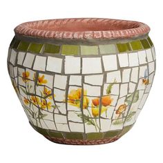 a mosaic vase with flowers painted on the front and sides, sitting on a white background