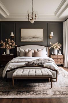 a large bed sitting in a bedroom on top of a hard wood floor next to a window