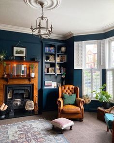 a living room filled with furniture and a fire place