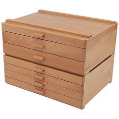 three wooden drawers stacked on each other with one drawer open and the other closed up