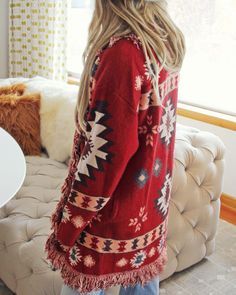 The softest knit base pairs with an Aztec print, blanket fringe & an easy long fit. Oversized long fit with an open front & soft fringe fold over collar. Cozy side pockets. Color: Desert rock, brown, pink & gray Acrylic/poly blend Hand wash cold Oversized fit. Model is a size 8 wearing a medium. Small Medium Large Bust 40 42 44 Waist 42 44 46 Hips 44 46 48 Length 36 36 36 Bust, waist, and hip measurements are a total circumference. Length is measured from the top of the shirt to the hem. Measure Bohemian Soft Knit Outerwear, Cozy Long Sleeve Outerwear With Fringe, Cozy Fringe Outerwear For Fall, Cozy Fringe Cardigan For Fall, Bohemian Fall Loungewear Outerwear, Bohemian Fall Outerwear For Loungewear, Bohemian Outerwear For Fall Loungewear, Bohemian Loungewear Outerwear For Fall, Blanket Fringe