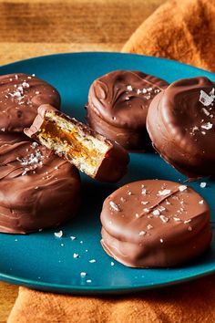 chocolate covered donuts on a blue plate