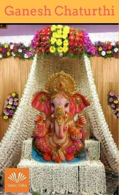 ganesh chaturthi greeting card with colorful flowers and an elephant statue in the background