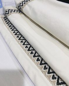 white linens with black and white designs on them