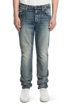 A tapered silhouette lends polished ease to casual jeans cut from stretch-kissed denim set with permanent wrinkles. Zip fly with button closure Five-pocket style 98% cotton, 2% elastane Machine wash, tumble dry Made in the USA Fitted Jeans With Welt Pockets And Standard Cut Leg, Casual Fitted Jeans With Welt Pockets, Classic Tapered Leg Jeans With Button Zip Fly, Casual Slim Fit Jeans With Welt Pockets, Slim Fit Cotton Jeans With Five Pockets, Slim Cotton Bottoms With Five Pockets, Casual Slim Fit Jeans With Button Closure, Fitted Jeans With Button Closure And Straight Hem, Medium Wash Tapered Cotton Jeans