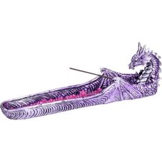 a purple dragon boat floating on top of water