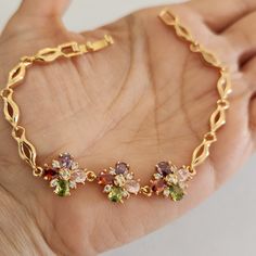 New 18k Gold Plated Multicolored Gemstones Diamond Flower Bracelet For Women Length Approx 7" All Photos Are From The Actual Item No Stock Photo Used. Measurements Shown In The Pictures. Color May Slightly Differ Due To Lighting. All Gemstones Are Simulated. Comes With A Jewelry Box. Please Check Out My Other Jewelry. Wedding Engagement Anniversary Earrings Gift. Birthday Gift. Same Or Next Day Shipping. Elegant Multicolor Gold Plated Bracelets, Elegant Multicolor Gold-plated Bracelets, Gold Cubic Zirconia Bracelet With Gemstone Accents, Gold Multi-stone Bracelet For Gift, Multicolor Gold Jubilee Bracelet, Elegant Multicolor Flower-shaped Jewelry, Gold Cubic Zirconia Flower Bracelets, Gold Flower-shaped Cubic Zirconia Bracelets, Gold Flower Bracelets With Cubic Zirconia