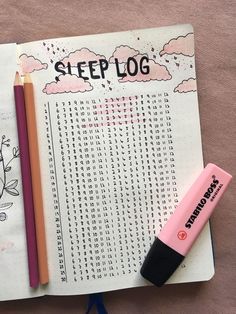 an open notebook with writing on it and two pencils next to it