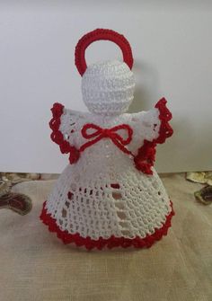 a crocheted doll sitting on top of a table