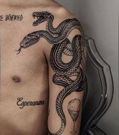 a man with a snake tattoo on his arm