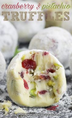 cranberry and pistachio truffles with powdered sugar on top