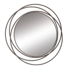 a round mirror with metal rings around it