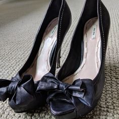 All Reasonable Offers Are Welcome! Beautiful, Playful Peep Toe Miu Miu Black Heels. Leather Bow Covers Top Of Toe Box Area. Pre-Owned Although Signs Of Wear Are Mostly On The Heels Which Have Gotten Dinged Here And There By Sidewalk Grates, Etc. These Could Definitely Be Fixed Up By A Cobbler. The Upper Of The Shoe Is In Excellent Condition. Had Vibram Rubber Soles Put On The Bottom Of The Shoe By Professional Cobbler To Protect The Shoe And Extend It's Life. Its A Very High Heel But It Has A Pl Leather Platform Court Shoes For Party, Leather Bow Heels For Party, Leather Closed Toe Heels With Bow, Leather Heels With Bow And Round Toe, Miu Miu Open Toe Formal Heels, Miu Miu Formal Open Toe Heels, Chic Miu Miu Platform Heels, Miu Miu Platform Heels With Round Toe, Miu Miu Closed Toe Heels For Formal Occasions