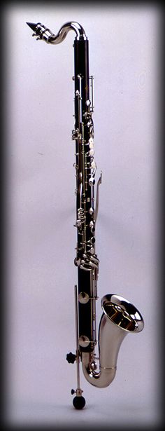 a silver and black musical instrument on a white background