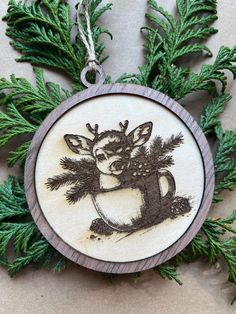 a wooden ornament with an image of a deer