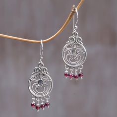 These earrings from Putu Putri celebrate Bali's ornate artistry. They are crafted with sterling silver creating a melodious contrast with glistening garnets. .925 Sterling silver. Wire Jewelry Earrings, Easy Diy Jewelry, Filigree Earrings, Flower Pendant Necklace, Work Jewelry, Diy Crafts Jewelry, Sterling Silver Flowers, Rhinestone Jewelry, Beads Jewelry