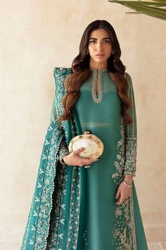 Kameez Sharara Dupatta Blue Pakistani Wedding Dress has the perfect balance of style and grace. This masterpiece comes in premium quality fabric and is adorned with threads, mirror details, and cutwork, making it an epitome of beauty and elegance. Blue Kameez: The kameez comes has a beautiful blue color. Hand-crafted details of dabka, motifs, and pearls give a glamorous look to this blue kameez. Mirror details, threads, and cutwork give a perfect finish to the kameez. Sharara Kameez: The embelli Pakistani Designer Clothes, Pakistani Wedding Dress, Pakistani Fancy Dresses, Pakistani Fashion Party Wear, Mode Abaya, Ruffle Pants, Stylish Party Dresses, Dress Indian Style, Boutique Fashion