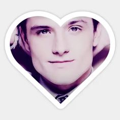 a heart shaped sticker with a man's face